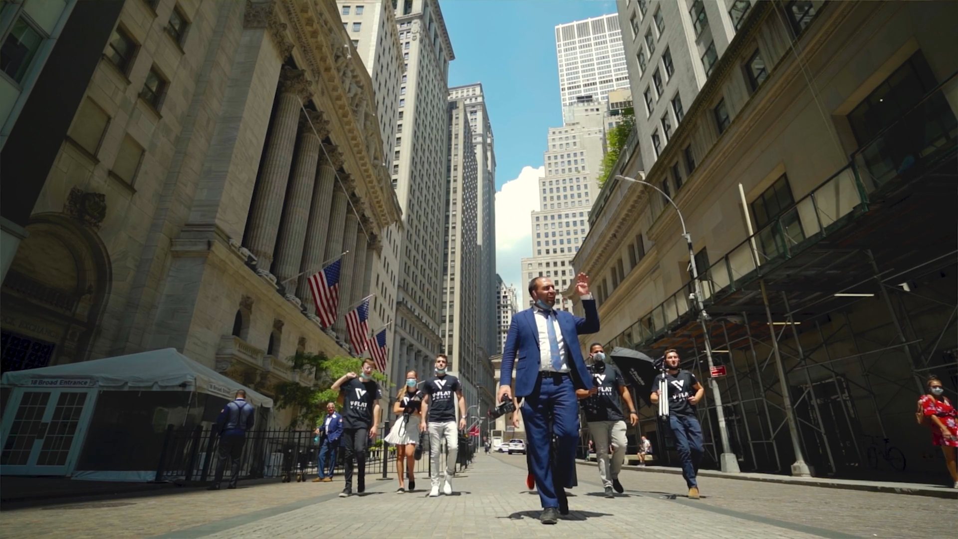 An executive walking through Wall Street, captured by LAIBEL